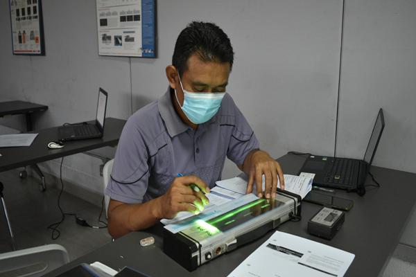 NDT technician performing magnetic particle inspection